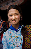 Smiling Asian girl wearing traditional clothing