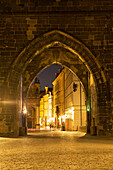 Arches in stone wall outside city