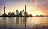 Shanghai city skyline reflecting in waterfront, Shanghai, China