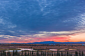 Scenic view of the village of Noatak with the Baird Mountains in the distance at sunrise, Arctic Alaska, USA, Autumn