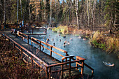 Travelers take a break at Liard River Hot Springs along the Alaska Highway, British Columbia, Canada
