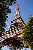 Looking up to the impressive Eiffel Tower in Paris, France, Europe