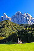 Church of Ranui surrounded by green meadows in autumn, St. Magdalena, Funes Valley, South Tyrol, Dolomites, Italy, Europe