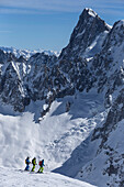 Skiers before departure to Vallee Blanche with Grandes Jorasses 4208 m, Aiguille du Midi 3842 m, Chamonix, France