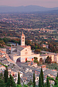 View over Assisi to Santa Chiara Basilica at sunset, Assisi, Perugia District, Umbria, Italy, Europe