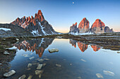 Dawn illuminates the Three Peaks and Mount Paterno  reflected in the lake, Sesto, Dolomites, Trentino-Alto Adige, Italy, Europe