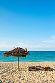 Beach chairs and shade umbrella on Puka Shell Beach, Boracay Island, Aklan Province, Western Visayas, Philippines