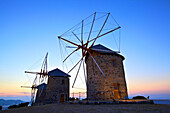 Illuminated windmills of Chora, Patmos, Dodecanese, Greek Islands, Greece, Europe