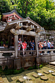 Otowa-no-taki spring, visitors taking sacred waters, Kiyomizu-dera, Buddhist temple in summer, Southern Higashiyama, Kyoto, Japan, Asia