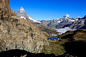 Matterhorn and Dent Blanche and the blue waters of Lake Riffelsee, Zermatt, Canton of Valais, Pennine Alps, Swiss Alps, Switzerland, Europe