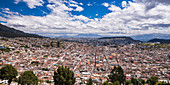 City of Quito with the Historic Centre of Quito Old Town in the foreground, seen from El Panecillo Hill, Quito, Ecuador, South America
