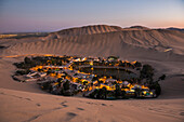 Huacachina, surrounded by sand dunes at night, Ica Region, Peru, South America