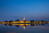 Mandalay City Fort and Palace reflected in the moat surrrounding the compound at night, Mandalay, Myanmar Burma, Asia