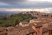 Storm clouds clearning over Perugia's historic centre, Perugia, Umbria, Italy, Europe