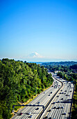 Aerial view of Mount Rainier and freeway, Seattle, Washington, United States