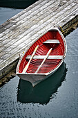 A homemade wooden skiff sits ready at the dock, Halibut Cove, Alaska, United States of America