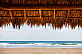 Shaded shelter with straw top in Playa Hermosa, Nicaragua