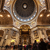 Papal altar and tourists, St. Peter's Basilica, Rome, Italy