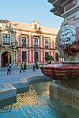 Fountain and pedestrians, Seville, Andalusia, Spain