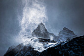Wind sweeping snow off mountains, Torres del Paine National Park, Patagonia, Chile, South America