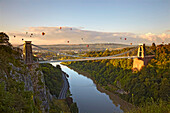 Clifton Suspension Bridge with hot air balloons in the Bristol Balloon Fiesta in August, Clifton, Bristol, England, United Kingdom, Europe