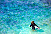 Surfer on a beach.