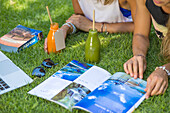 Two young girls reading magazine