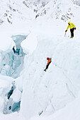 Two mountain rangers of Denali National Park practise a crevasse rescue on a glacier on Mount McKinley, also know as Denali, in Alaska. Every climbing season High Mountain Rangers patrol on the mountain between base camp and the summit. Every other day th