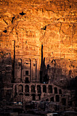 Carved stone facades at Petra, Jordan at sunset.