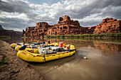 Rafts along the shore of the Colorado river. Photo taken during a rafting trip down Cataract Canyon, Utah.