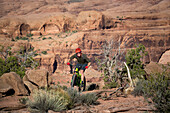 A man mountain biking on the Captian Ahab trail, Moab, Utah.