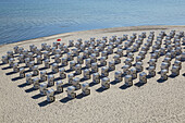 Beach chairs on a sandy beach near Sellin pier, Ruegen, Mecklenburg-Western Pomerania, Germany