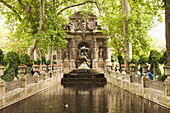 Ornate statue over park stream