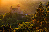 The sun lighting up castle Berwartstein in Erlenbach near Dahn, Palatinate Forest, Rhineland-Palatinate, Germany