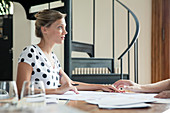 Woman working with colleague