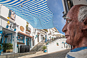 a street in mijas, statue representing picasso, costa del sol, the sunny coast, andalusia, spain