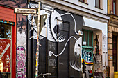 graffiti on a facade on oranienstrasse, kreuzberg quarter, berlin, germany