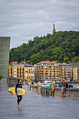 surfers, zurriola beach, san sebastian, donostia, basque country, spain