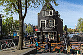 terrace of the sluyswacht cafe dating from 1695, jodenbreestraat, amsterdam, holland