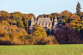 the abandoned chateau of the hermit in the colors of the autumn forest, region of rugles (27), france