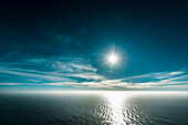 Scenic view of sea against bright sky