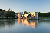 Bridge St. Benezet over Rhone River with Notre Dame des Doms Cathedral and Papal Palace at sunrise, UNESCO World Heritage Site, Avignon, Vaucluse, Provence-Alpes-Cote d'Azur, France, Europe