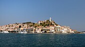 Poros town and harbour viewed from the sea, Poros island, Attica, Peloponnese, Greece, Europe