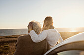 Older Caucasian couple looking at ocean view