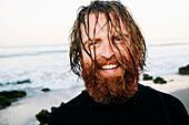 Caucasian surfer with wet hair at beach