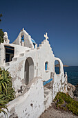 Traditional church on rocky oceanfront