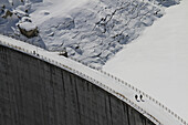 High angle view of snow covered dam and frozen reservoir