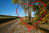 Giant red heart on Poppenhausener Liebesweg trail of love