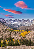 Fall sunrise with glowing clouds and aspen, Eastern Sierra California