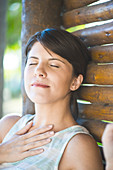 Woman relaxing with eyes closed